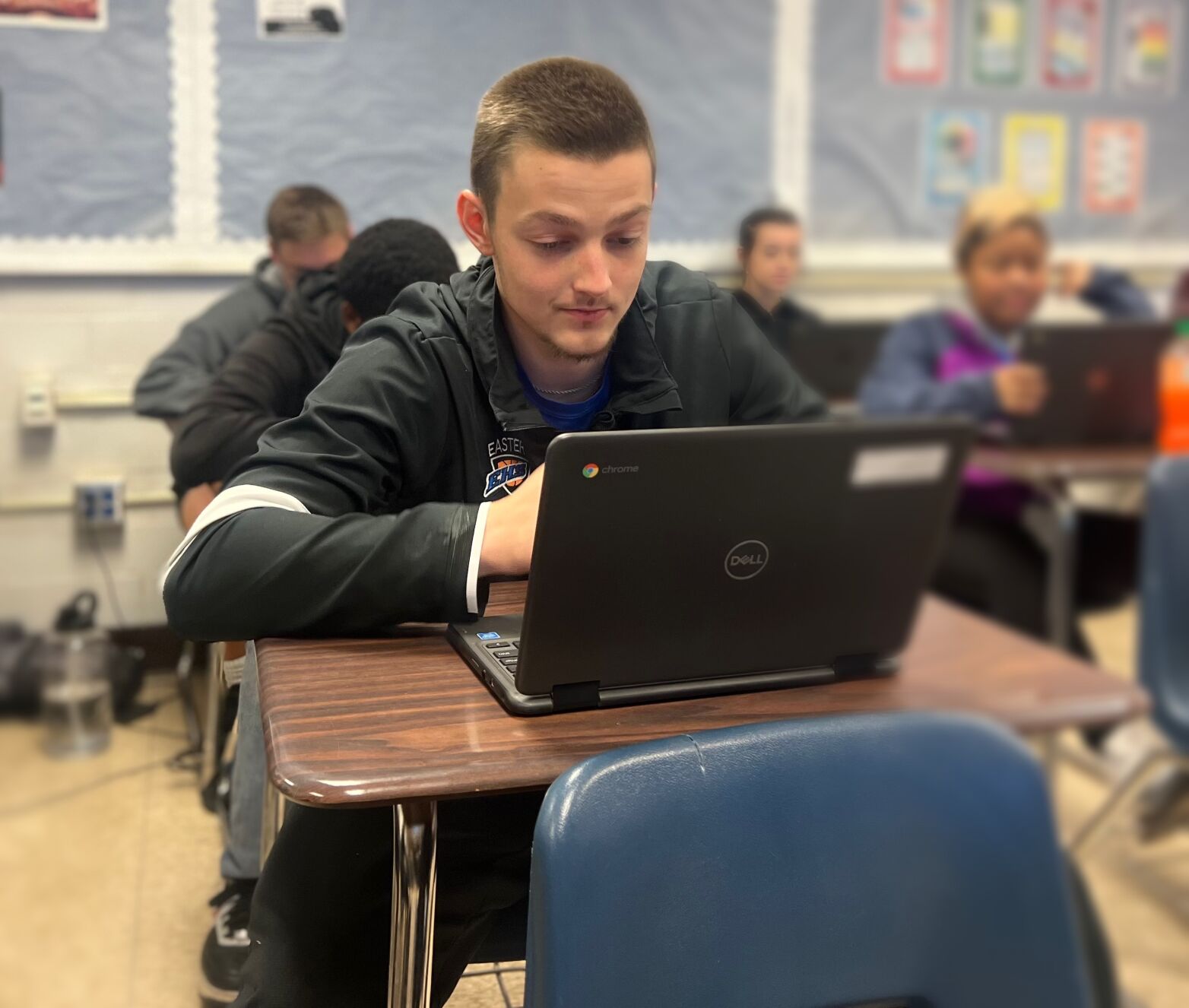 Doughty works in class during school day